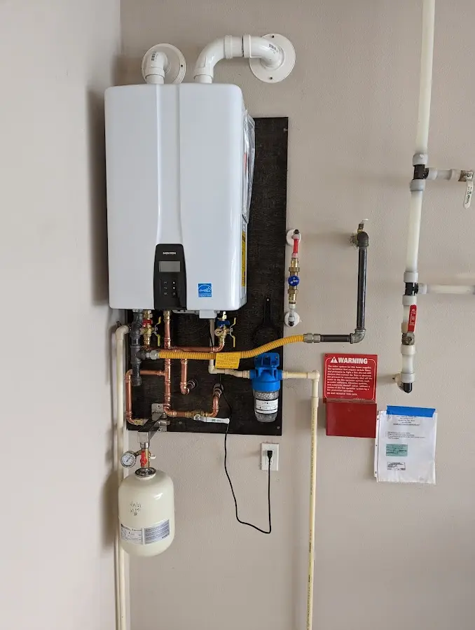 Professional plumber installing copper piping in a Leacock home